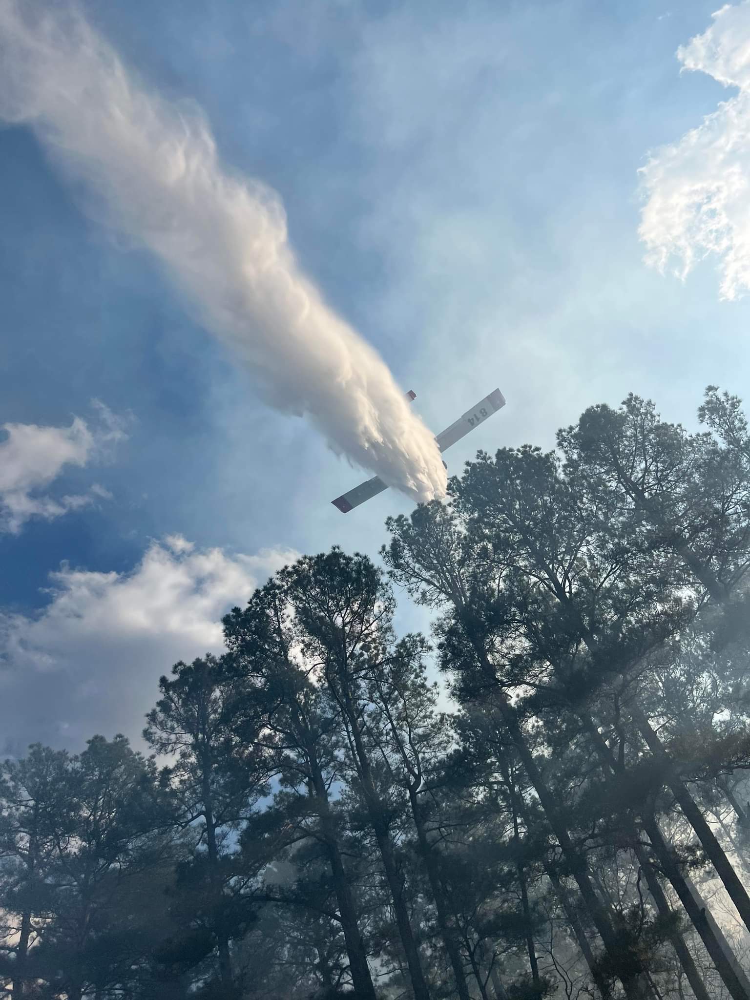 Wildfire threatens homes, shuts down state highway