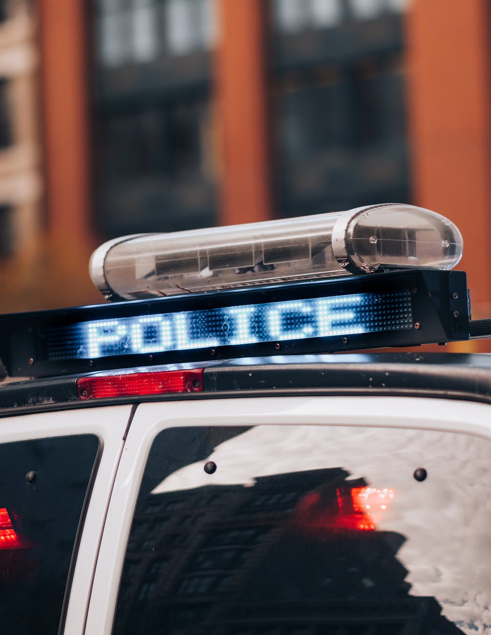 close up of police car roof and sign