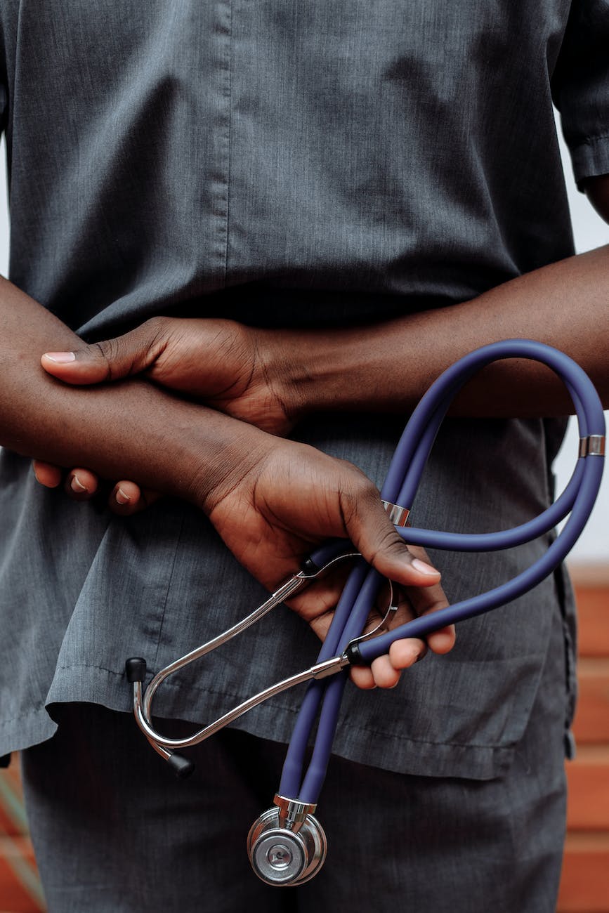a medical person holding a stethoscope