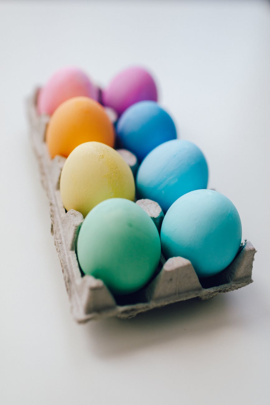 colored eggs on white surface