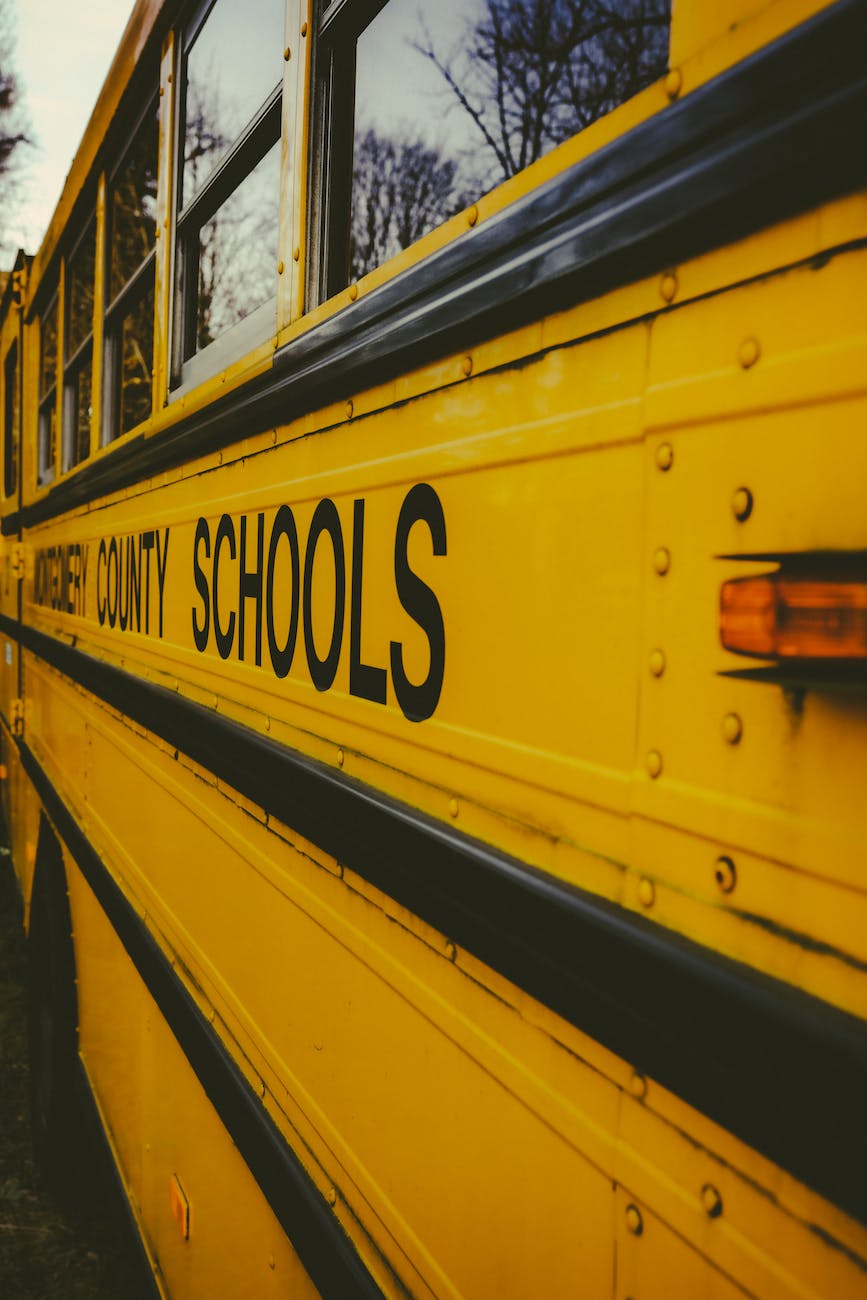close up photo of yellow and black school bus