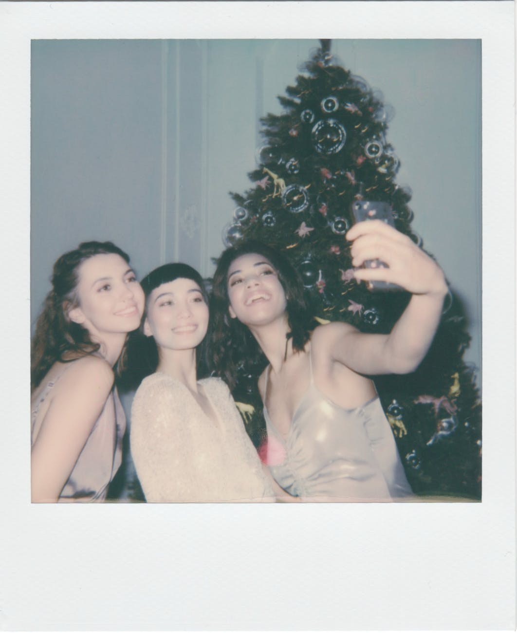 three women taking picture