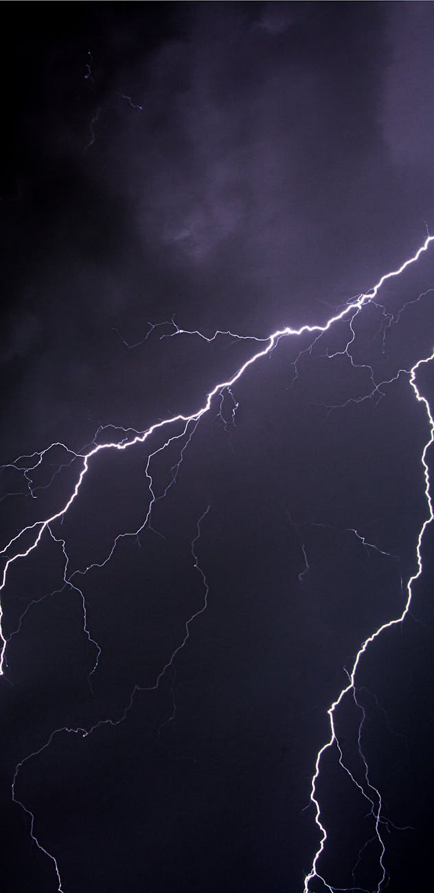 dramatic lightning strikes in night sky