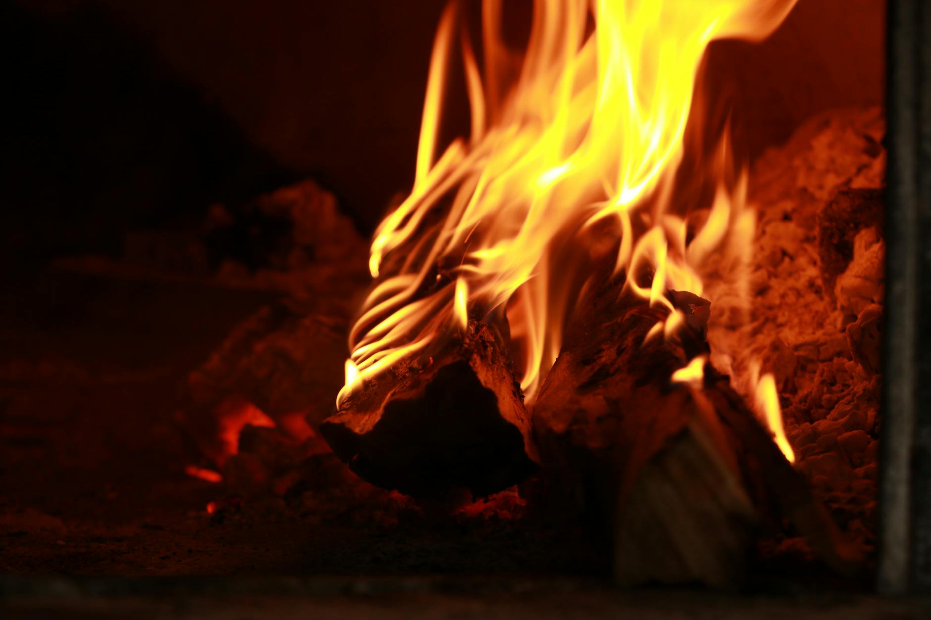 vibrant flames in a rustic wood fired oven