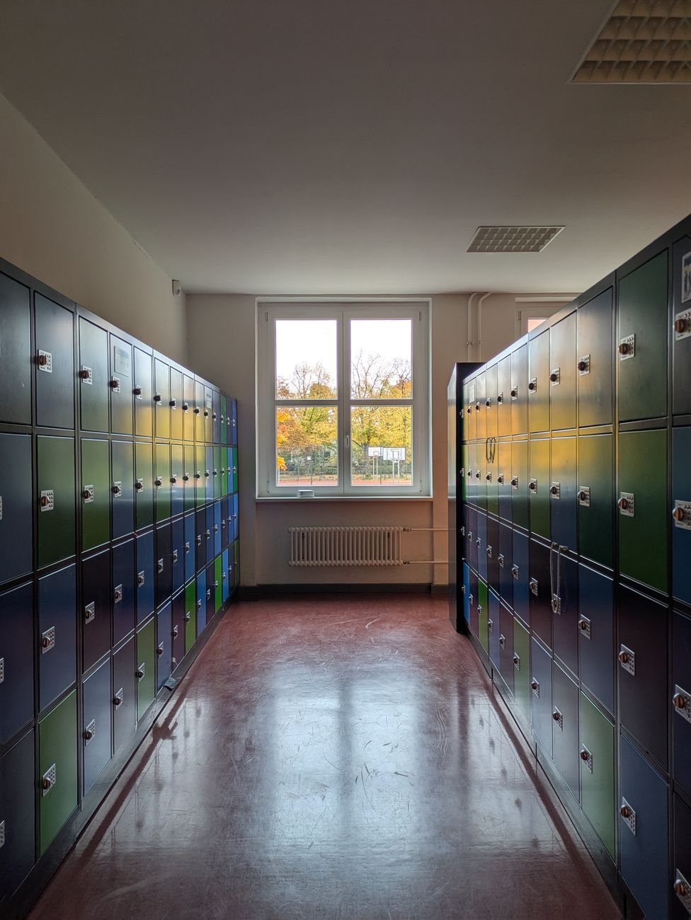 colorful lockers in a sunny school hallway