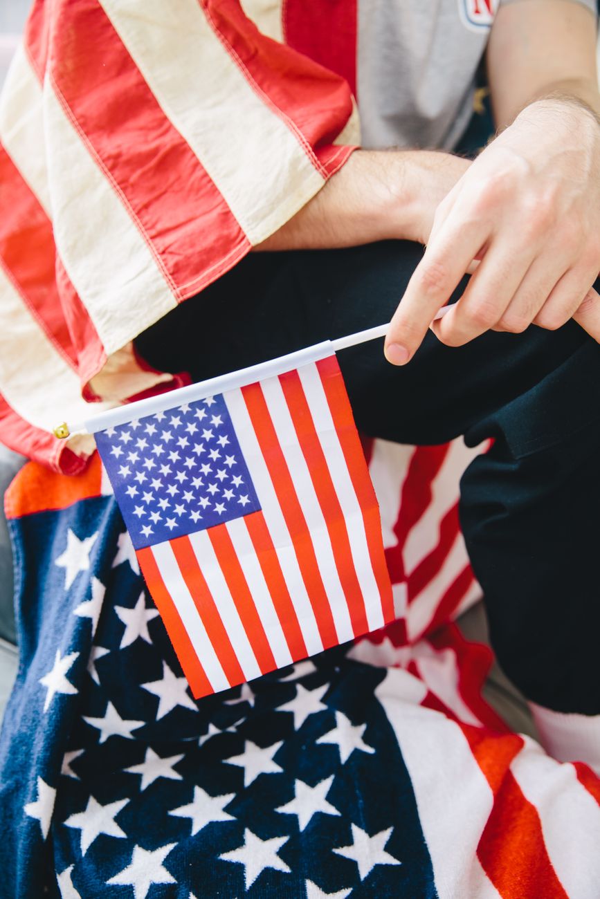 person holding an american flag