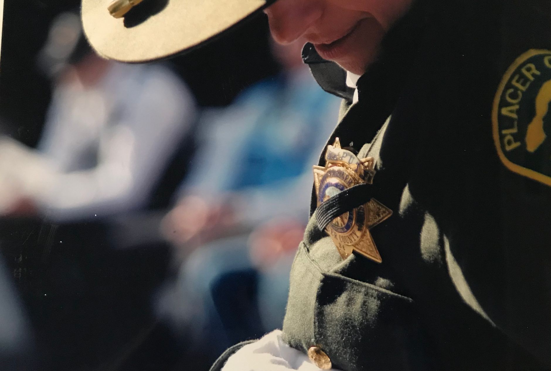 policeman looking at his badge
